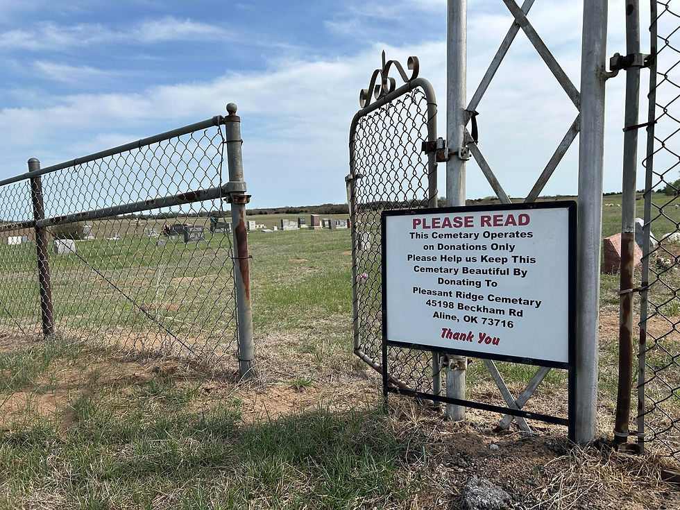 An open gate on the north side of the cemetery remains open for visitors. A sign reminds visitors to be respectful of cemetery grounds, maintained by local volunteers through donations.