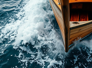close up image of a wooden boat in turbulent water.jpg