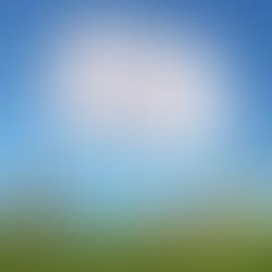 Cloud shaped like a home with young couple laying in the grass below it