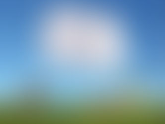 Cloud shaped like a home with young couple laying in the grass below it