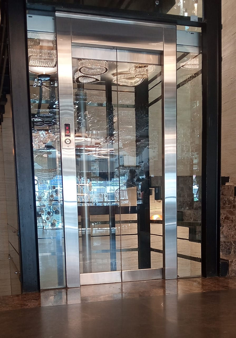 Frameless Glass Elevator Enhances Hyderabad Home's Aesthetic