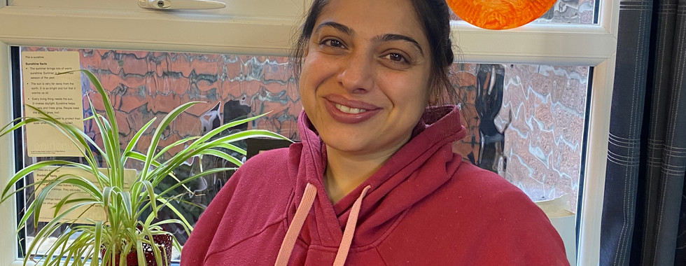 A woman involved in childcare volunteering opportunities at Shining Stars CIC