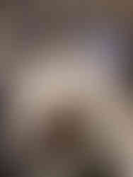 Rich chocolate mug cake in a coffee mug with a spoon, made in the microwave and ready to eat.