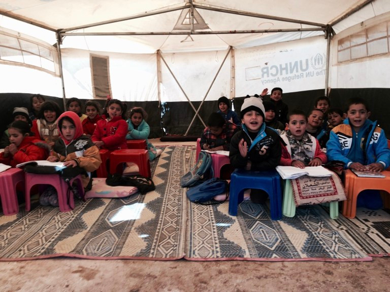 syrian refugee students in a tent