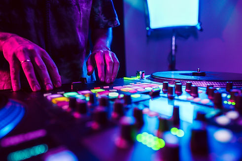 close-up-of-dj-hands-on-dj-console-mixer-during-co-2023-11-27-05-15-16-utc.jpg