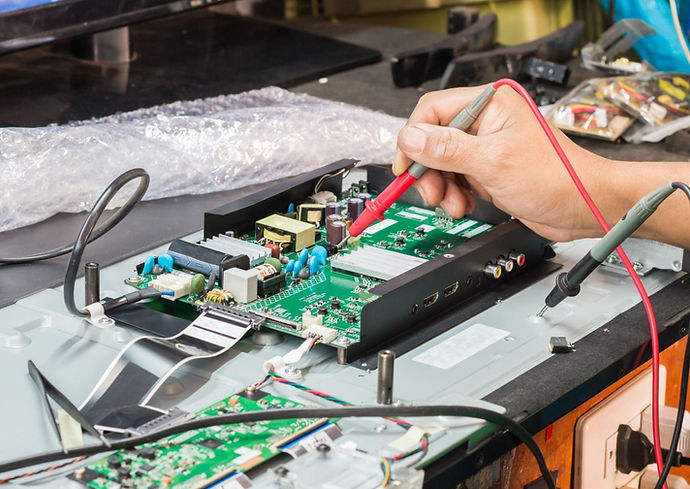 Electronics Technician working on a circuit board