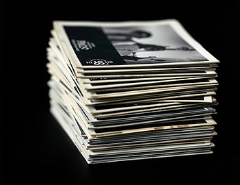 side profile of a stack of old black and white photographs.jpg
