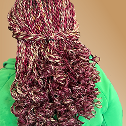 Burgundy and honey blonde Senegalese Twist with curly tips pulled into a low ponytail