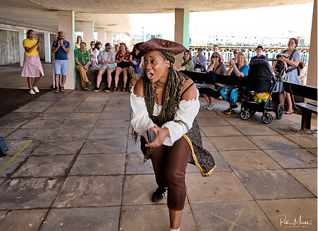 A photo of a woman in a pirate outfit, dancing