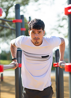 handsome-sportsman-working-out-sunny-day-man-sportive-clothes-open-air-sports-ground-exerc