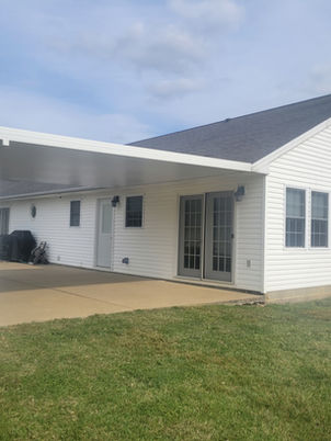 White aluminum patio cover on a ranch home.