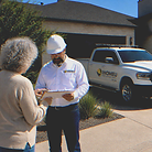 IHOMEU estimator preparing a detailed painting and flooring estimate for a homeowner in West Texas.