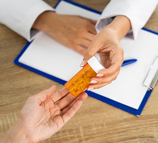 high-angle-people-holding-pills (1).jpg