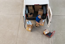 courier-delivering-parcel-PQZHBGE.jpg