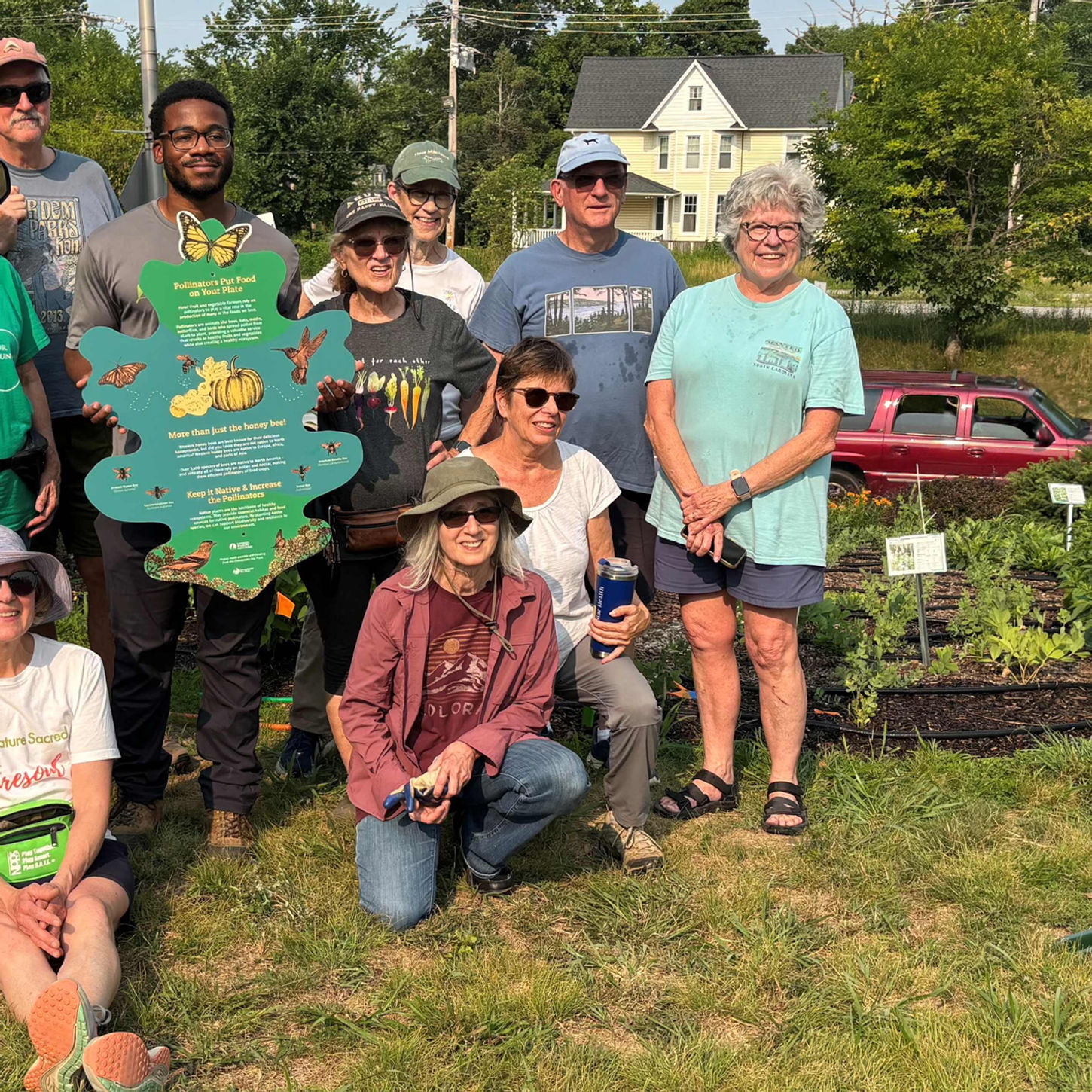 Volunteers with National Wildlife Federation sign
