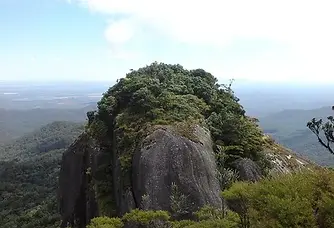 Kahlpahlim Rock, Far North QLD, tutorlife favourite hike of 7 hours round trip. Vast blue sky and rolling hills behind the smooth rocked face shaped like a lamb