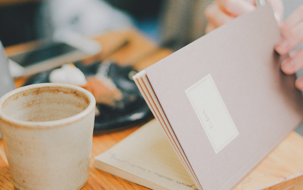 person opening book near coffee cip_edit