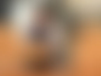 A woman packing boxes for storage for a small business.