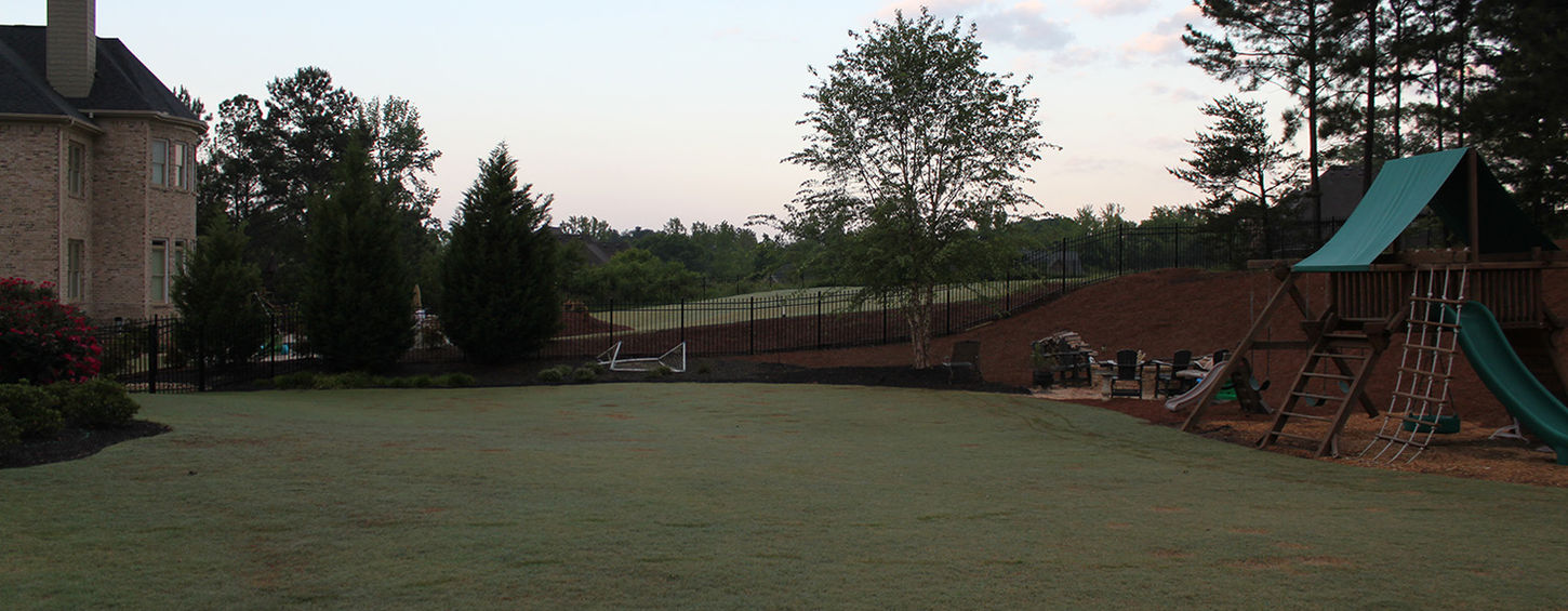Unfinished outdoor space before CHI Construction installed pool and hot tub