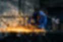 worker-doing-gate-by-electric-steel-cutter-machine.jpg