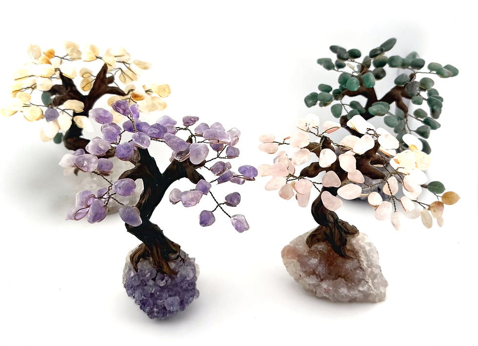 4 small bonsai-style handmade trees with stone base and stone leaves. Shown in pink, purple, yellow and green.