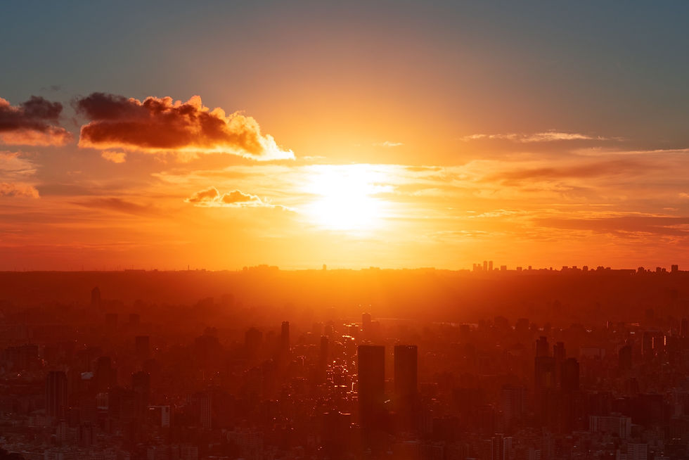 Sun setting over an urban landscape