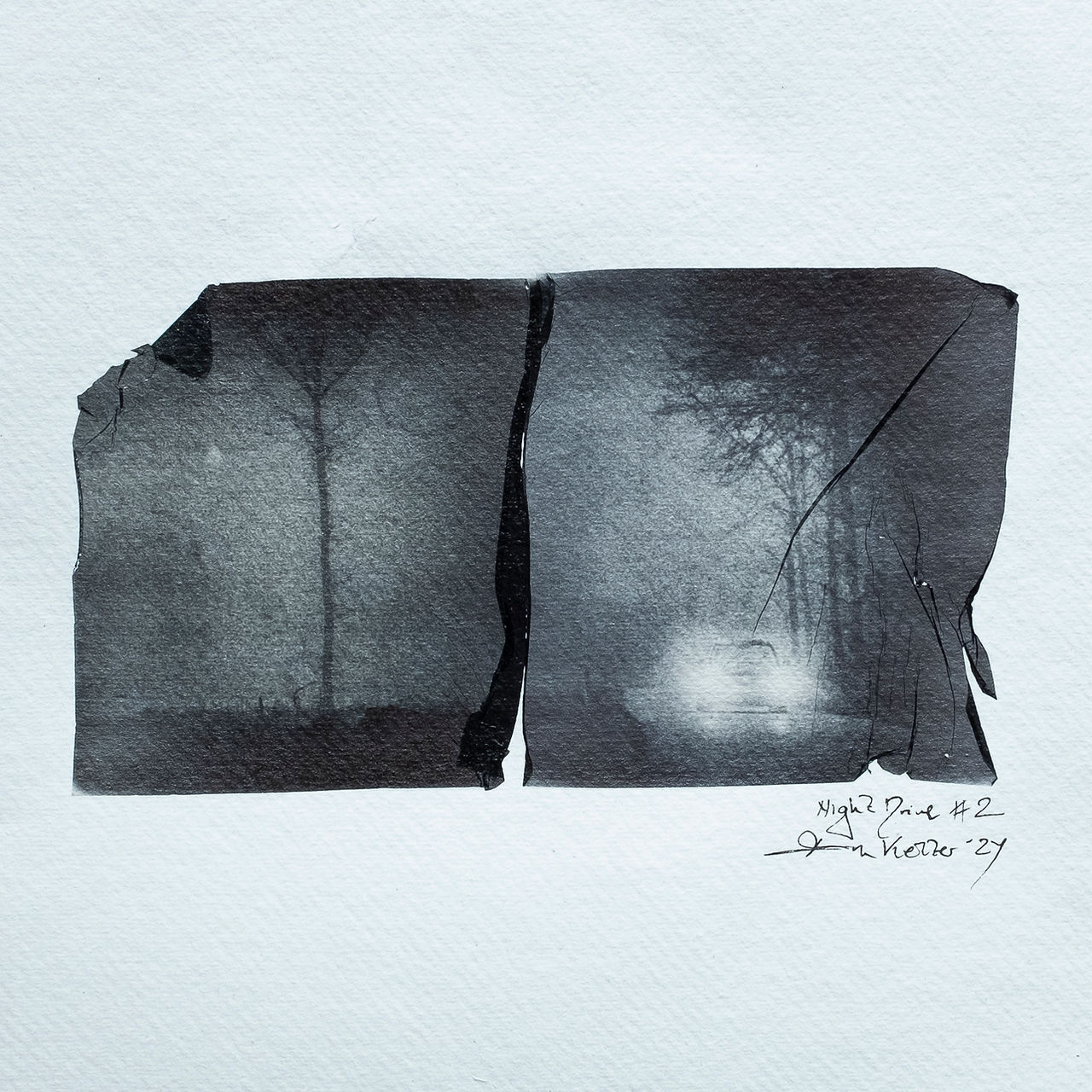 Night Drive No 2 is a Black and white polaroid emulsion lift showing a car driving through a dark forest
