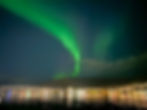 northern lights tromso arctic cathedral from the water