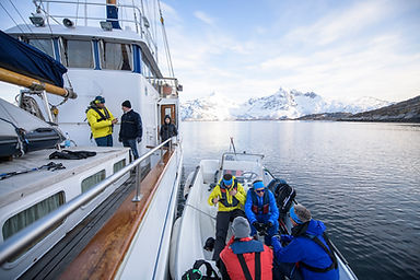 Stella Oceana crew preparing equipment and provisions on deck in Tromsø