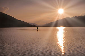 Stand up paddleboarding in a fjord near Bergen Norway