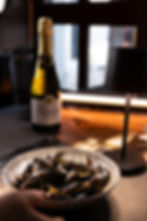 Intimate wedding villa Barcelona dinner with mussels and wine.