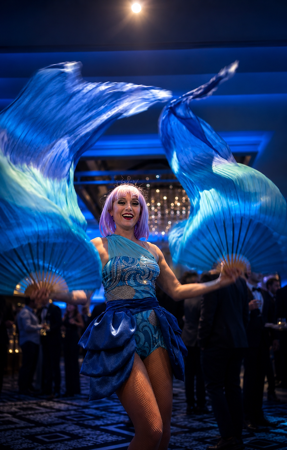 Underwater roving entertainer performing with blue silk fan veils at a themed event in Sydney by Cirqular Entertainment.