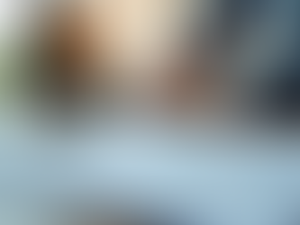 Document with charts on it and a person in the background