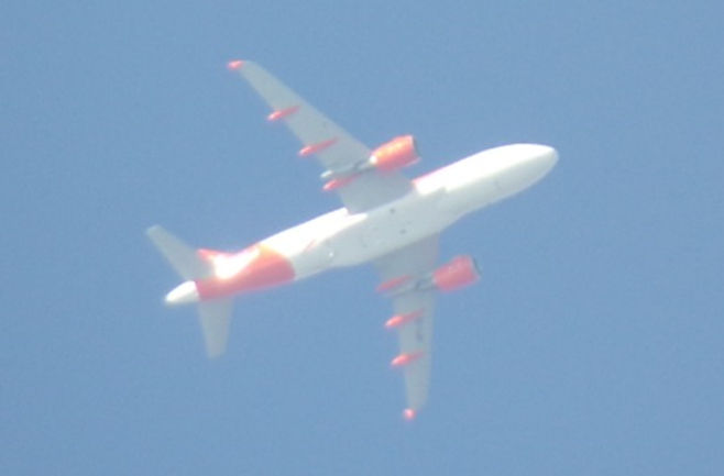 Image of an aeroplane in a blue clear sky.