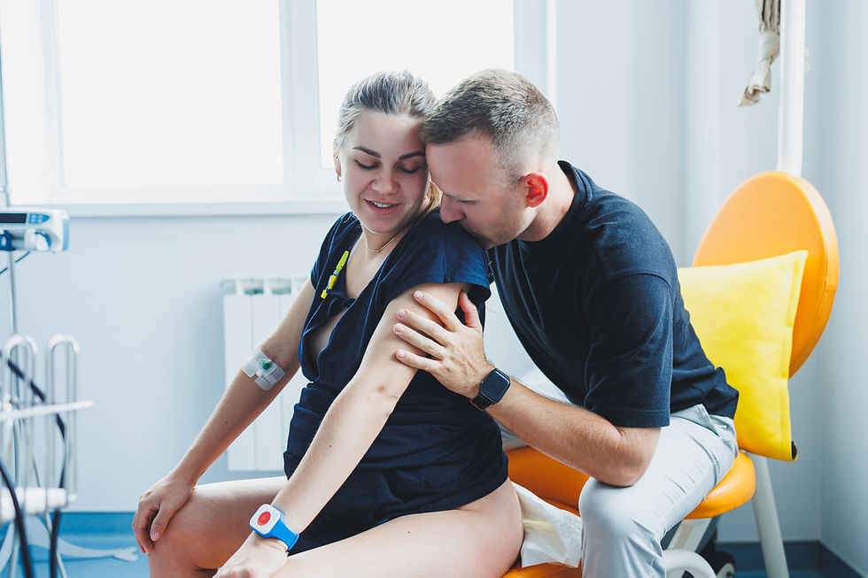 A husband hugs his wife who is giving birth Giving birth together Partnered birth Supporti