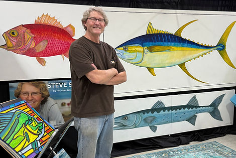 Steve with fish paintings.jpg