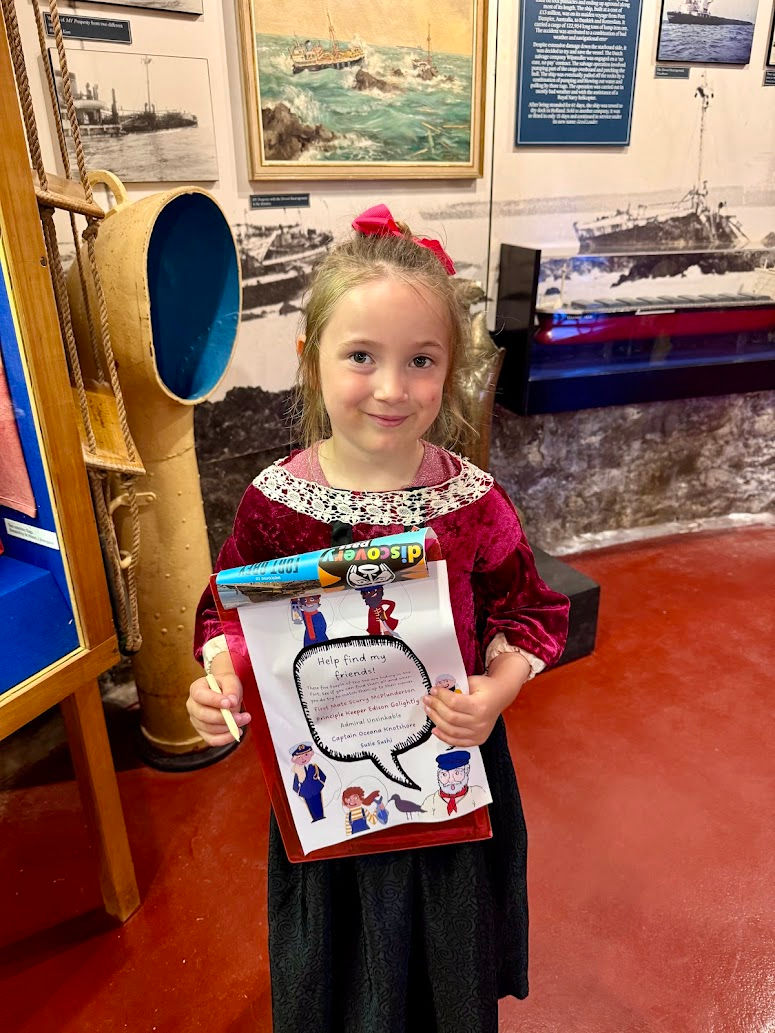 Emily searching for the hidden cartoons at the Shipwreck Museum