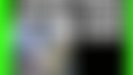 Surveillance photo of a man approaching a woman from behind with a belt ready to loop it over her head to attack her. 