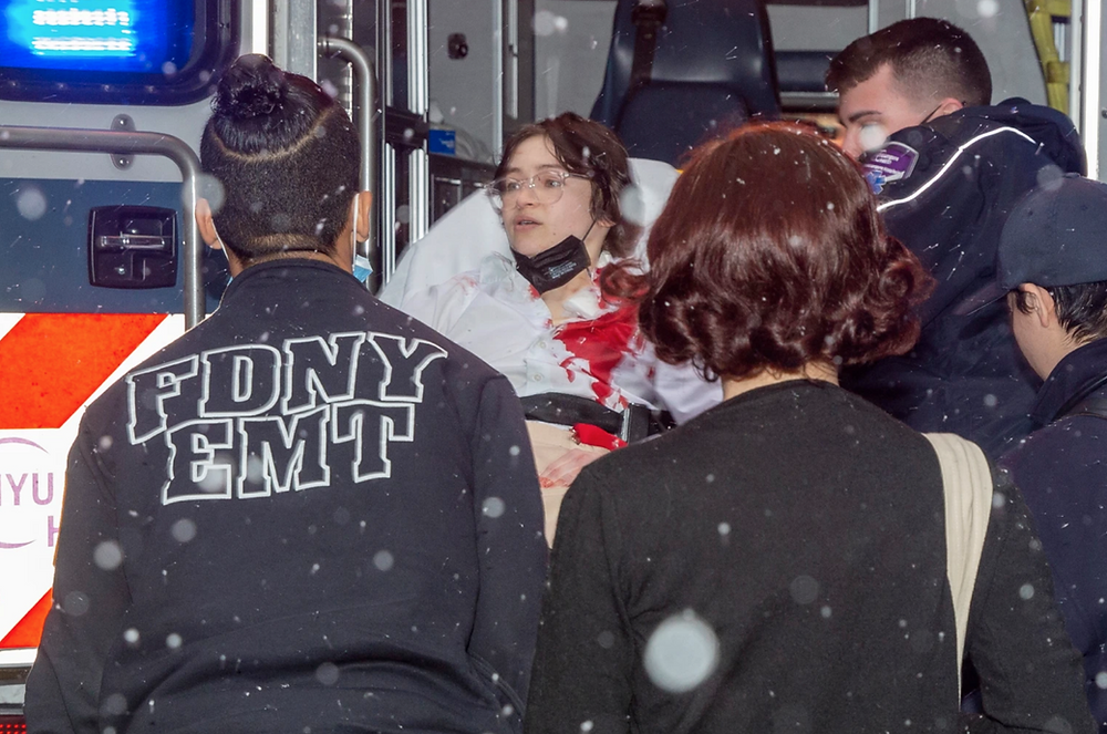 New York woman loaded into ambulance after knife attack at Museum of Modern Art.