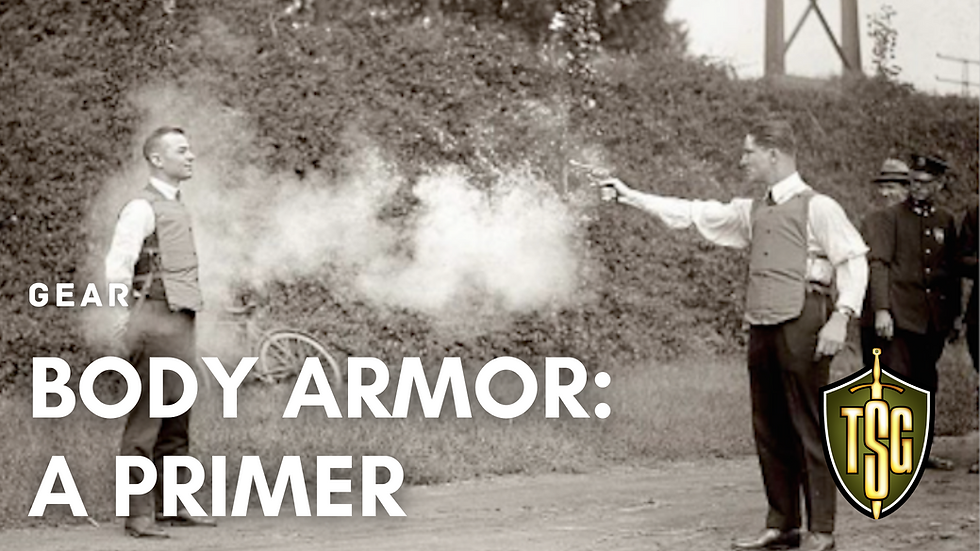 Man wearing body armor in 1923 testing bulletproof vest by being shot with a revolver.