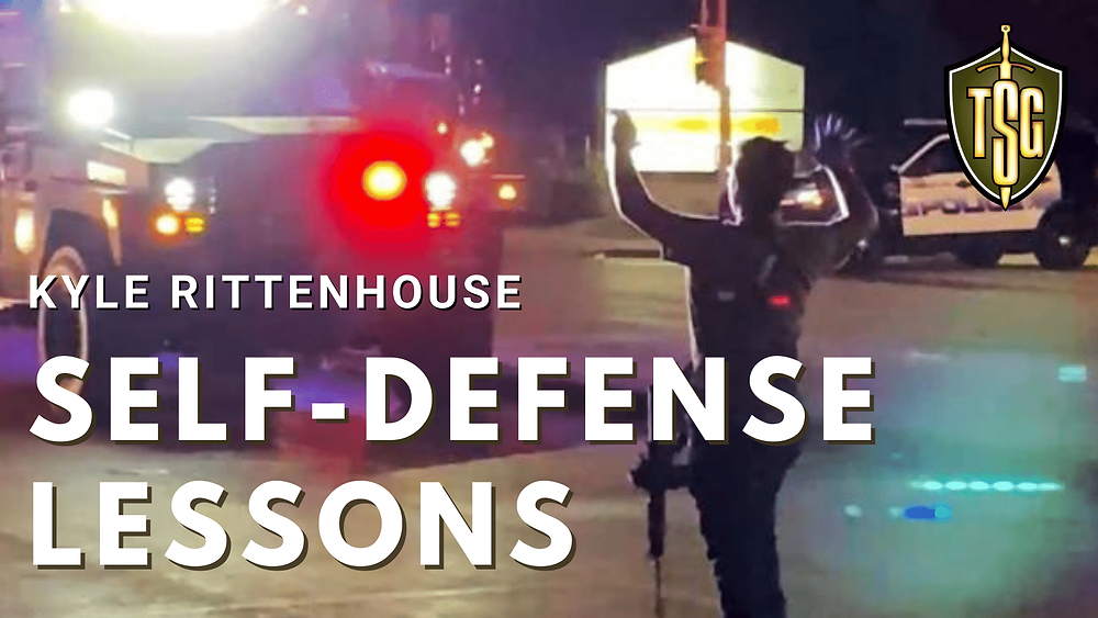 Photo of Kyle Rittenhouse with arms raised walking towards police in Kenosha, Wisconsin.