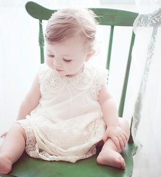 Child in Green Chair