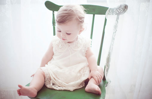 Child in Green Chair