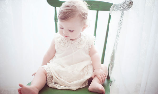 Child in Green Chair