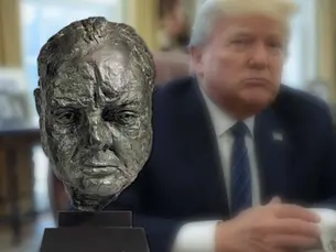 Donald Trump seated beside a bust of Winston Churchill in the Oval Office