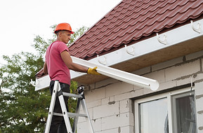 installing-rain-gutters.jpeg