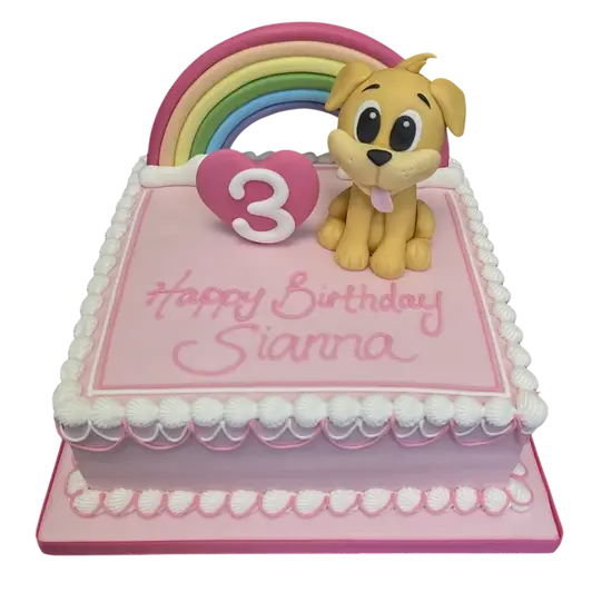 Bespoke celebration cake featuring a cute dog and vibrant rainbow in Solihull, West Midlands.