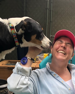 Coach Nan Enjoying a Moment with a Pup