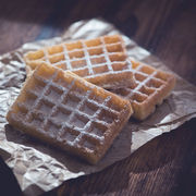 Our easy waffles are sprinkled with powdered sugar.