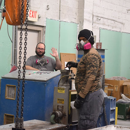 Photo of two employees in manufacturing area